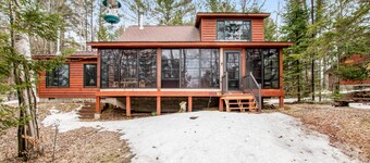 Riverfront vacation home with a dock, wood stove, full kitchen, & firepit