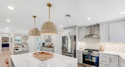Designer dream with fireplace, game room, private pool, outdoor kitchen, firepit