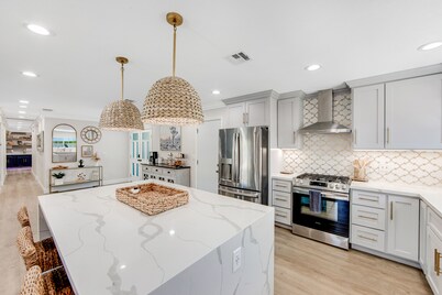 Designer dream with fireplace, game room, private pool, outdoor kitchen, firepit