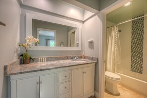 Combined shower/tub, hair dryer, towels, soap