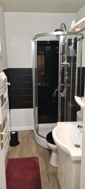 Shower, hair dryer, towels, soap