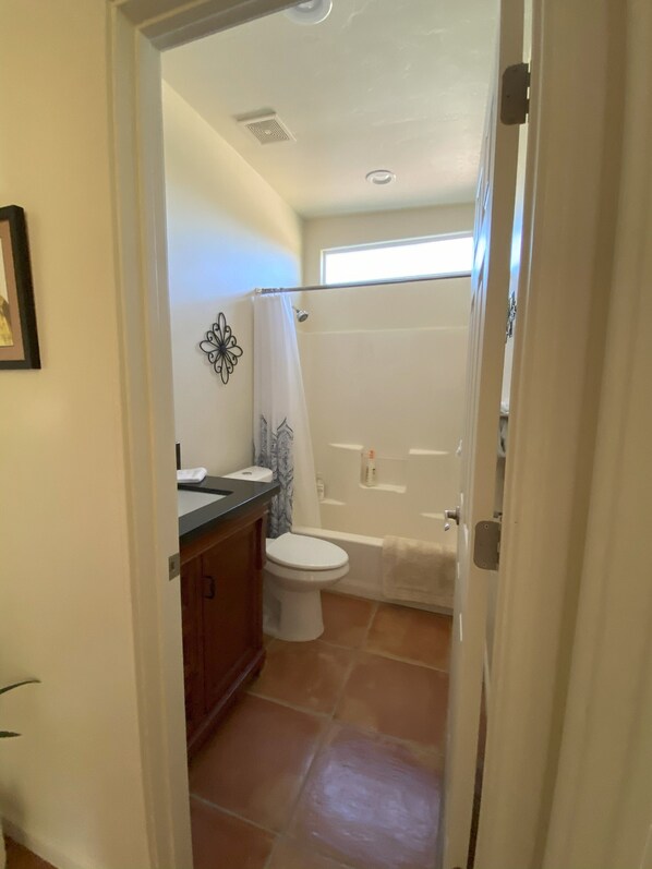 Combined shower/bathtub, hair dryer, towels, soap