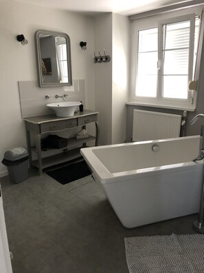 Bathtub, hair dryer, towels, soap