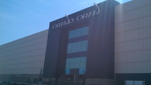 A large building with a sign reading "GRAND ORAN". - Oran sea & bay apartment (Oran)