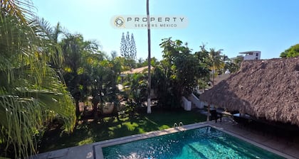 Steps from the beach, pool, games room and privacy!