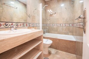 Bathtub, hair dryer, towels