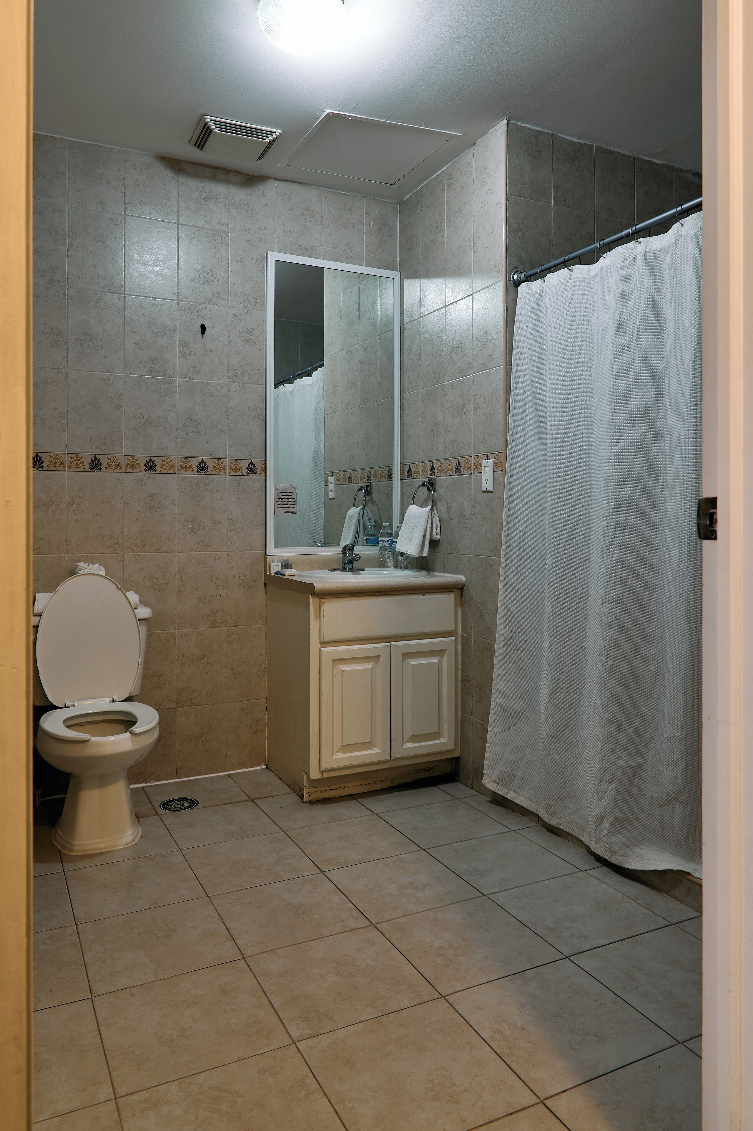 standard single room | bathroom | shower, hair dryer, towels, soap