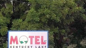 A motel sign with the name "Motel at Kentucky Lake". - Motel at KY Lake. Stars & Stripes. (Gilbertsville)