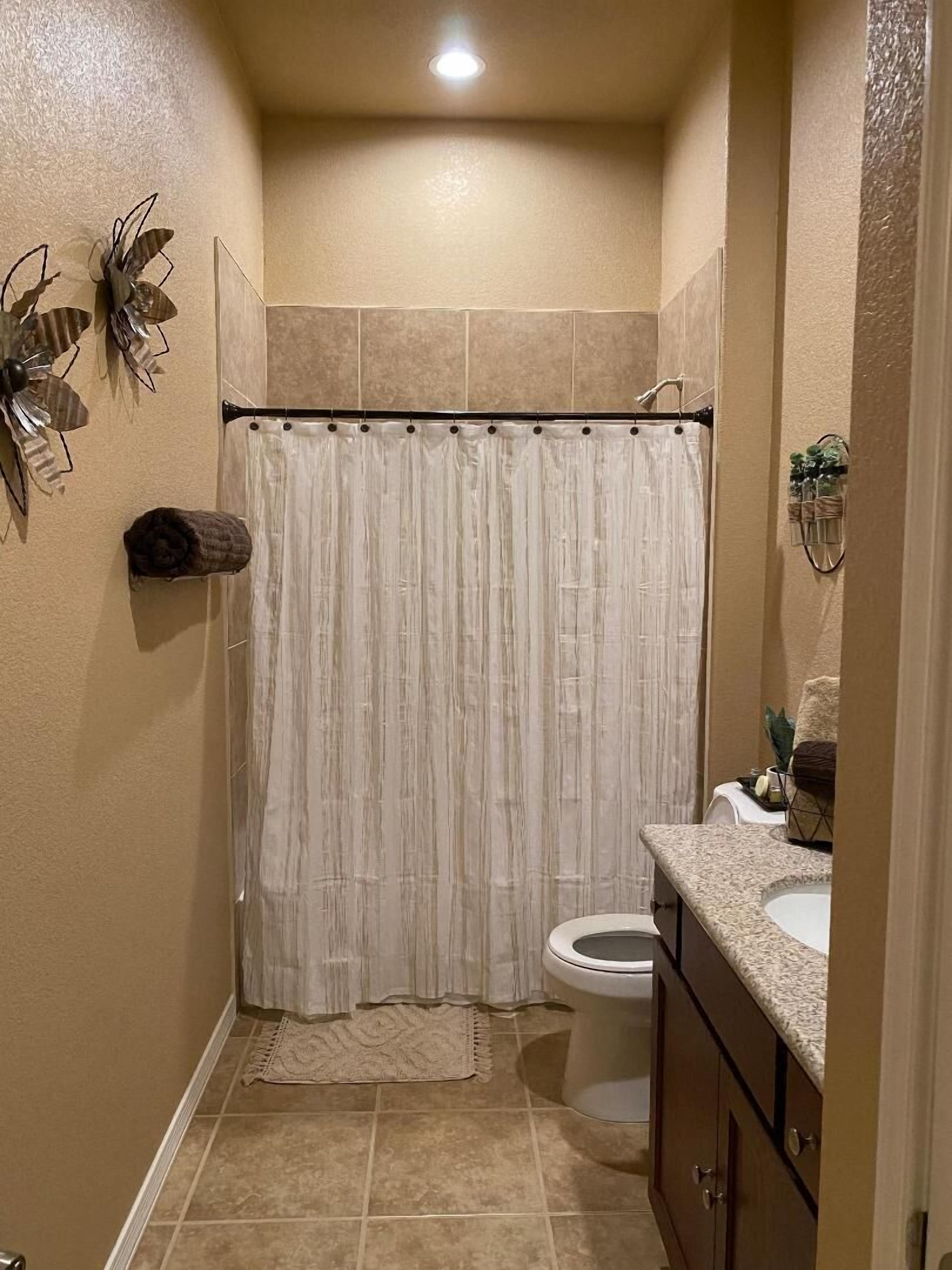 Combined shower/tub, hair dryer, towels, soap
