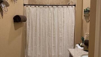 Combined shower/tub, hair dryer, towels, soap