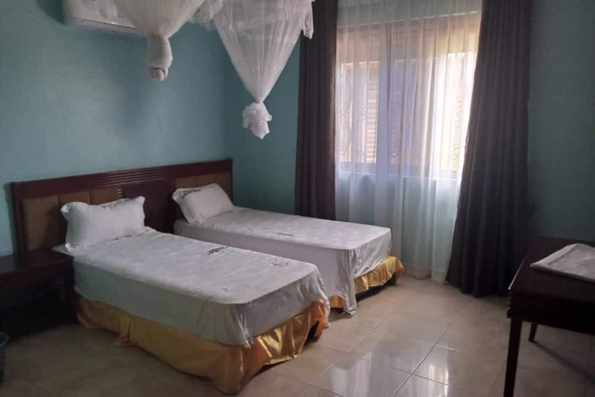 Deluxe Twin Room | Memory foam beds, individually furnished, laptop workspace, free WiFi