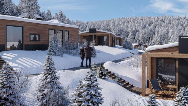A modern cabin with a wooden exterior, large windows, and a deck area with chairs. - mit 2 Schlafzimmern by Interhome (Kötschach-Mauthen)