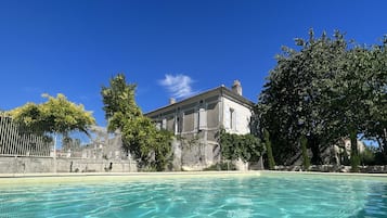 Seasonal outdoor pool, open 9:00 AM to 9:00 PM, pool umbrellas
