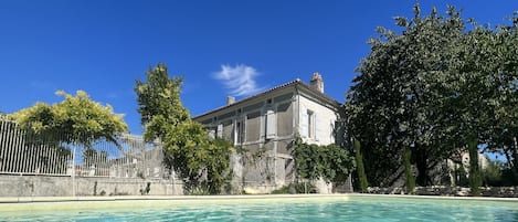 Seasonal outdoor pool, open 9:00 AM to 9:00 PM, pool umbrellas