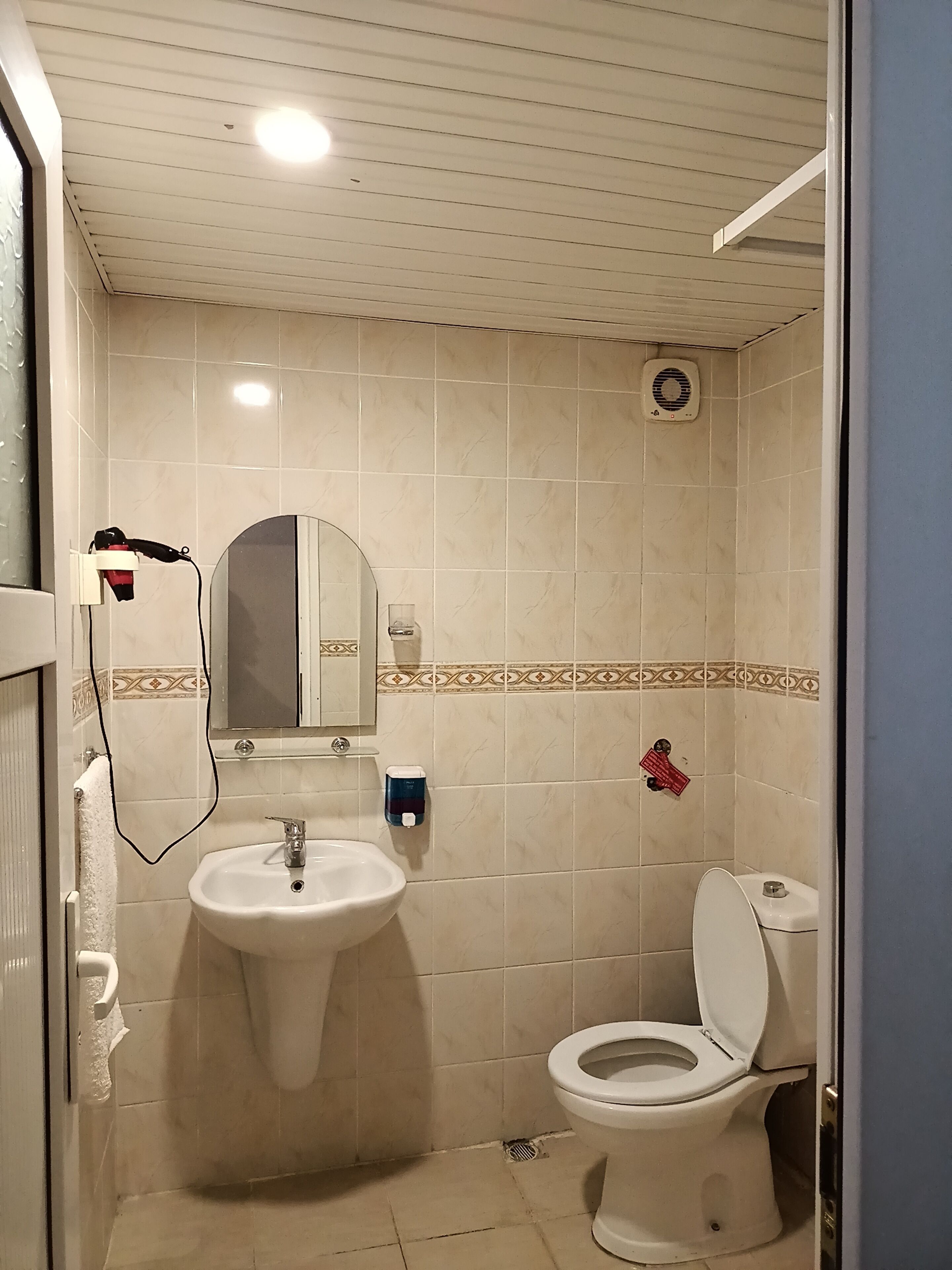 designer toiletries, hair dryer, towels, soap