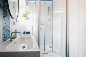 Shower, hair dryer, towels, soap