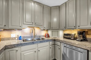 Coffee/tea maker, fridge, microwave, oven