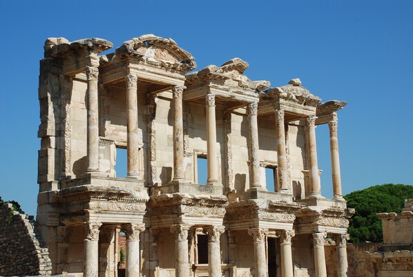 Ancient ruins with columns and intricate carvings.