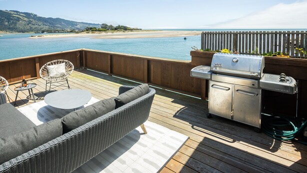 A deck with outdoor furniture, a grill, and a view of the beach. - Views for miles of the  Ocean and Bolinas Lagoon (Bolinas)