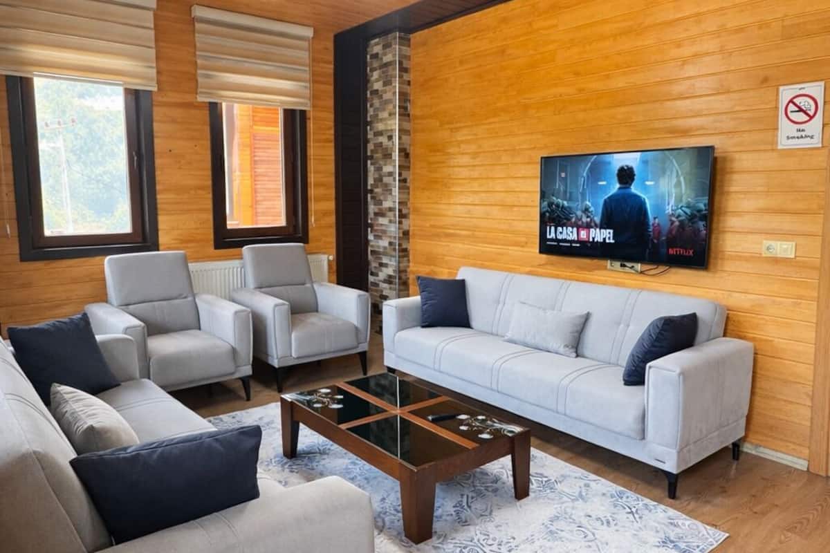 Deluxe Suite, Partial Lake View | Living area | 0-inch plasma TV with satellite channels, TV