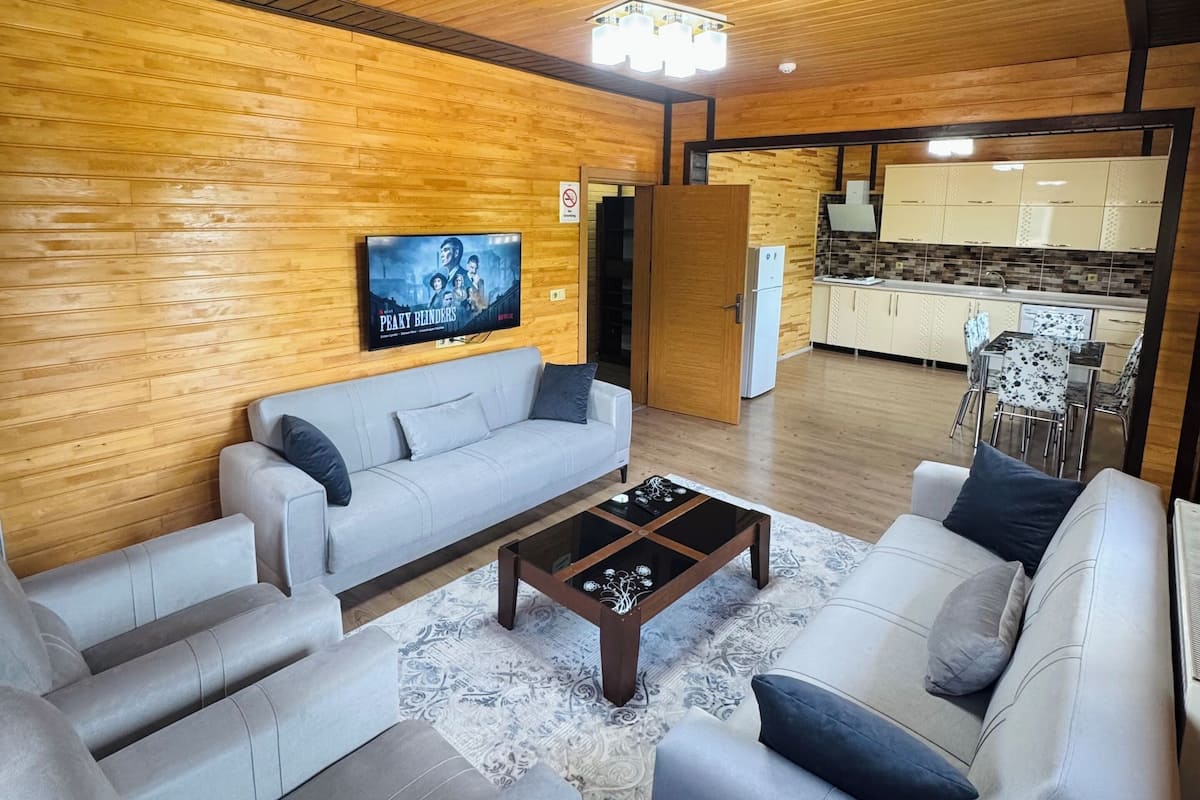 Deluxe Suite, Partial Lake View | Living area | 0-inch plasma TV with satellite channels, TV