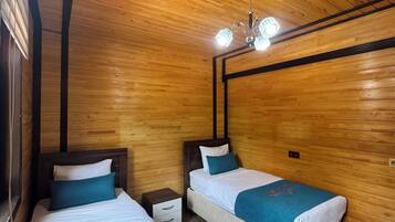 Deluxe Suite, Partial Lake View | Hypo-allergenic bedding, soundproofing, iron/ironing board