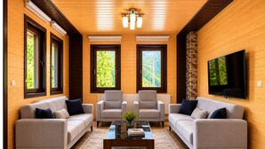 Suite Deluxe, vista parcial al lago | Área de sala de estar