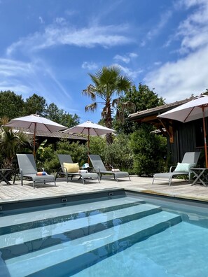 Outdoor pool, a heated pool, pool loungers