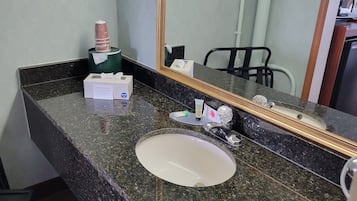Bathtub, hair dryer, towels, soap