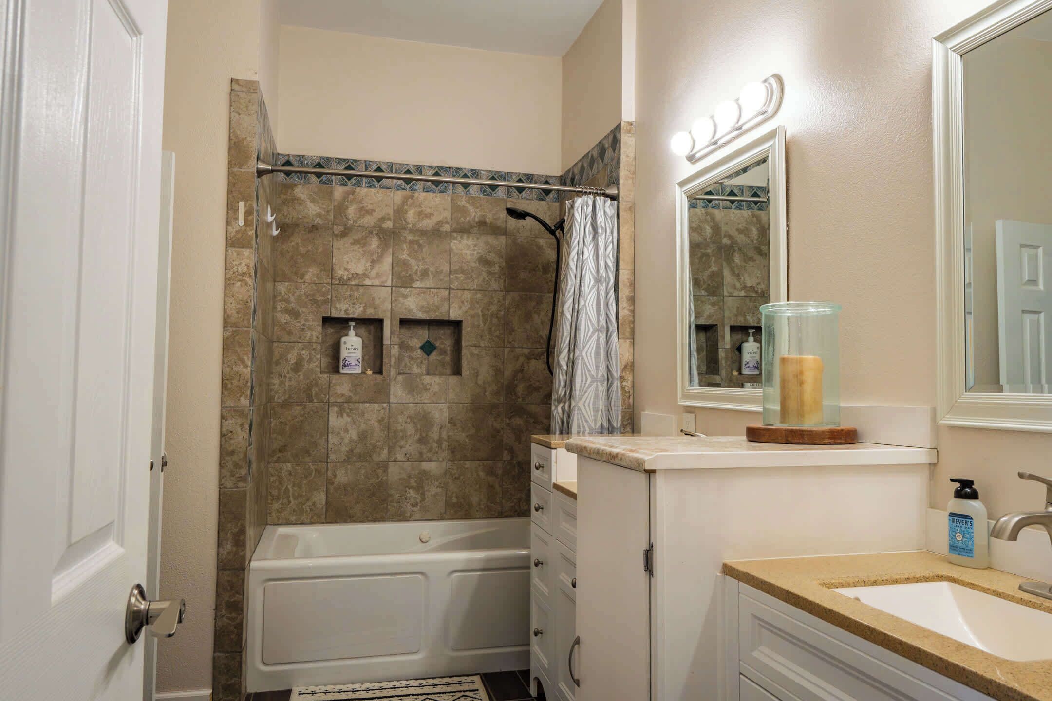 Combined shower/tub, hair dryer, towels, soap