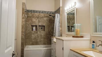 Combined shower/tub, hair dryer, towels, soap