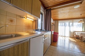 Fridge, coffee/tea maker, cookware/dishes/utensils
