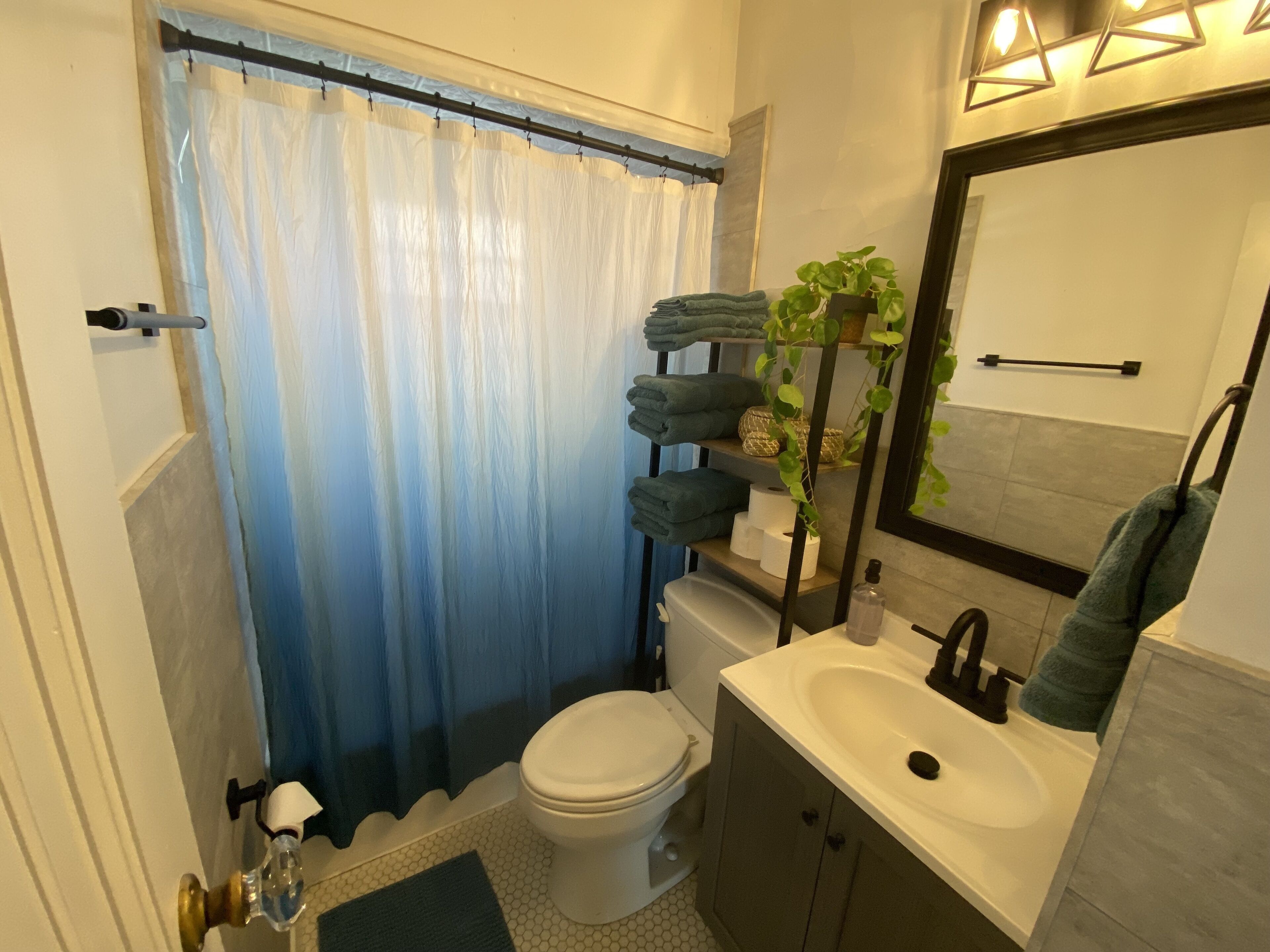 Bathtub, hair dryer, towels, soap