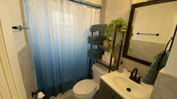 Bathtub, hair dryer, towels, soap