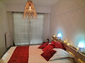 1 bedroom, desk, iron/ironing board, travel crib