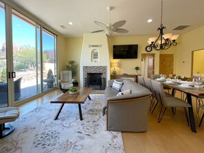 Smart TV, fireplace, books, printers