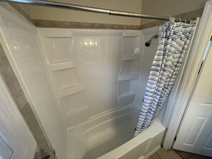 Combined shower/bathtub, hair dryer, towels, soap