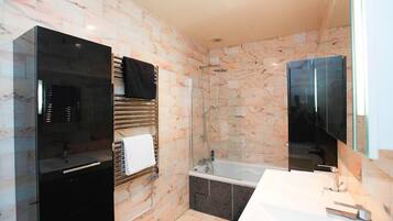 Combined shower/tub, hair dryer, towels, soap