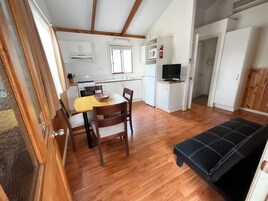 Deluxe Cabin, 2 Bedrooms | Living area | TV