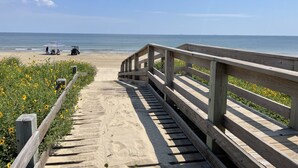 A wooden boardwalk leading to a beach with a clear view of the ocean. - Savings Alert! Pet-Friendly: Spacious, Fenced Retreat, Views! Games!  Sleeps 14 (Crystal Beach)