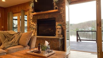 Smart TV, fireplace, books, stereo