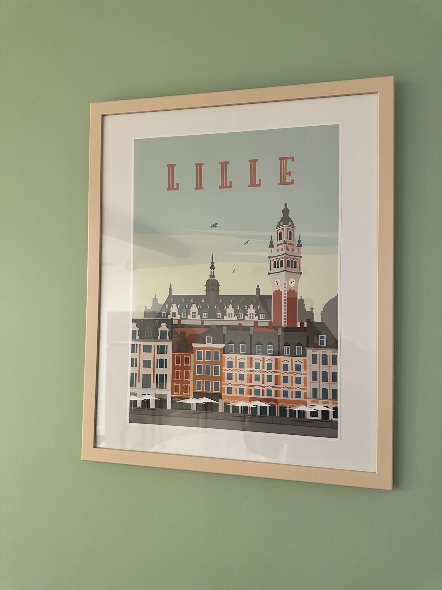 Ilustración enmarco de un paisaje urbano, con la palabra 'LILLE' destacada.