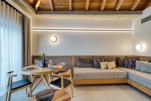 Luxury Suite With Pool View | Living area | 43-inch Smart TV with satellite channels, TV - Capital Luxury Suites (Nafplio)