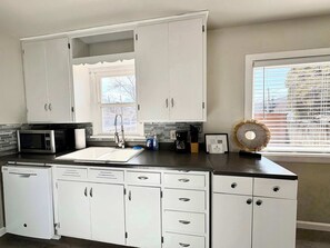 Fridge, microwave, oven, stovetop - Historic 2 bedroom home in Old Town-main floor (Pocatello)