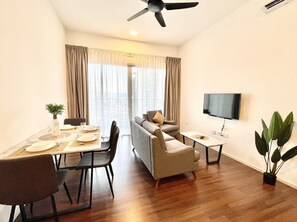 Superior Apartment, 3 Bedrooms, City View | Living room | 45-inch Smart TV with cable channels, TV