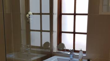 Shower, hair dryer, towels, soap
