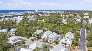 A residential area with houses surrounded by trees and a view of the ocean. - Family Beach House w/ LSV and Porches (Santa Rosa Beach)