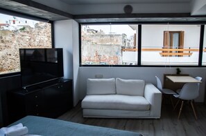 Comfort Studio | Living area | 55-inch Smart TV with digital channels, TV, Netflix
