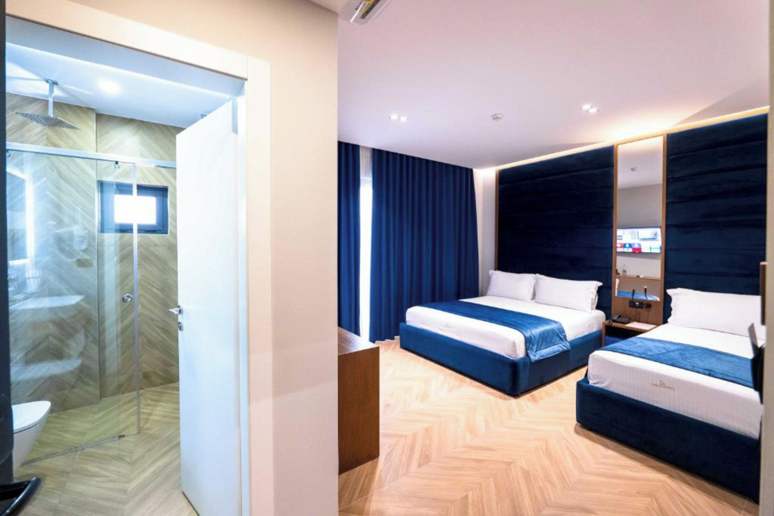 Exclusive Triple Room, Ground Floor | Minibar, free WiFi, bed sheets