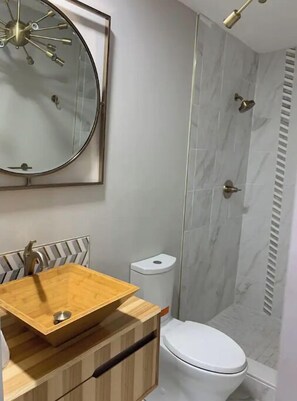 Shower, hair dryer, towels, soap